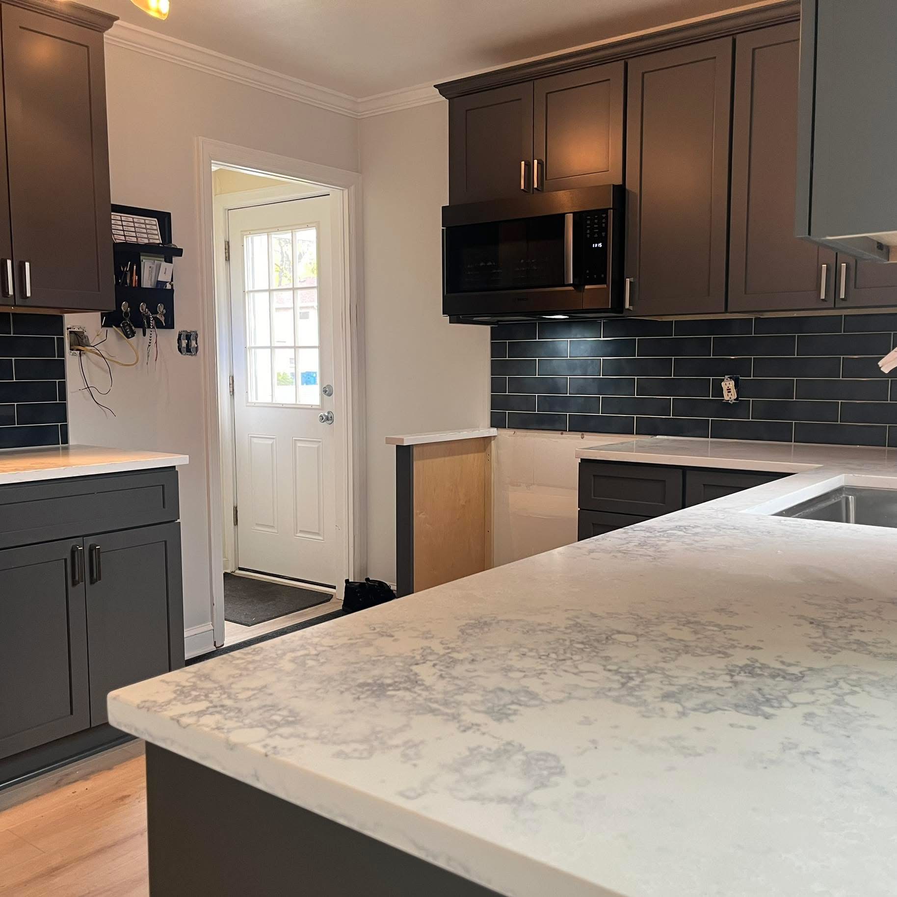 Black subway tile kitchen backsplash