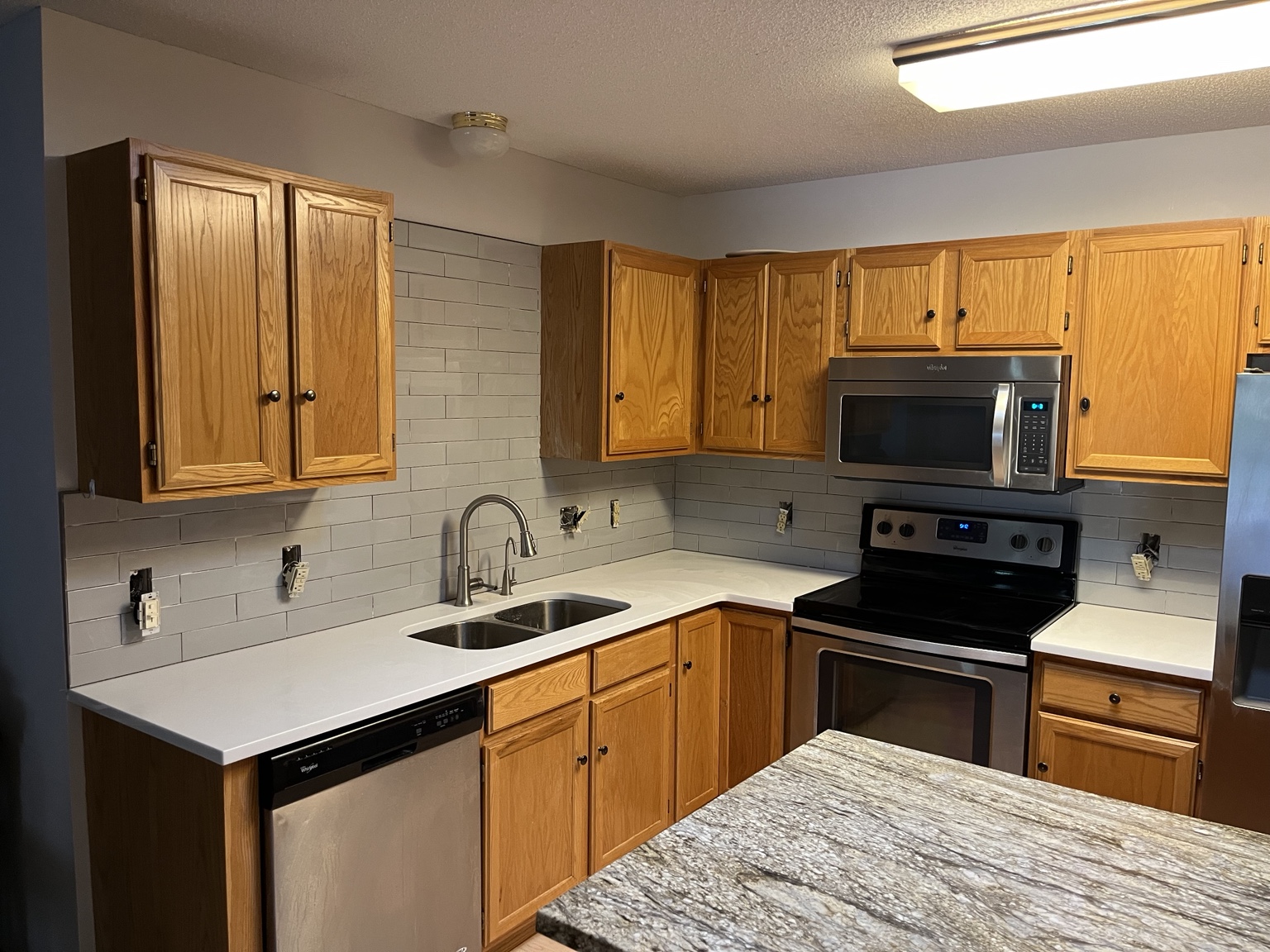 Gray subway tile backsplash